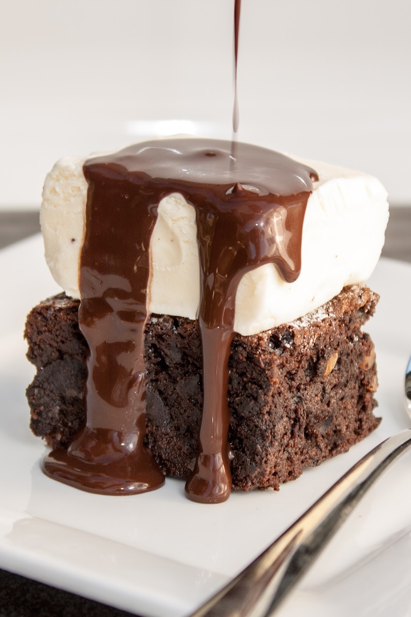 These brownies with warm chocolate sauce and a rich vanilla ice-cream are the perfect end to a Sunday Lunch. Decant the softened ice cream into a baking paper-lined tray, the day before, re-freeze,...