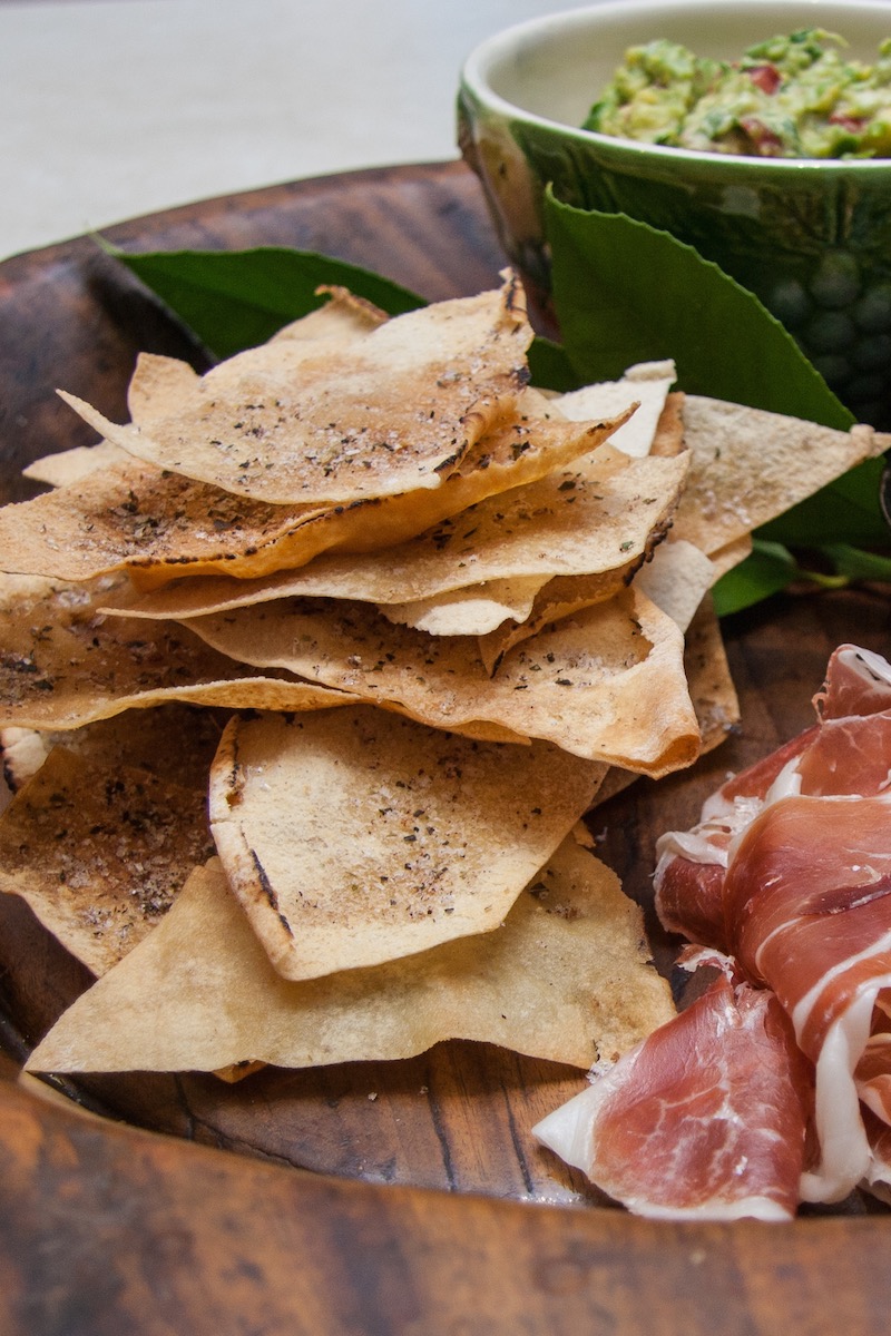 These crisps are my go-to cracker to serve with guacomole, hommus and dips. One packet of Lebanese bread goes a very long way, and they are really quick to make. You can flavour the oil with fresh...